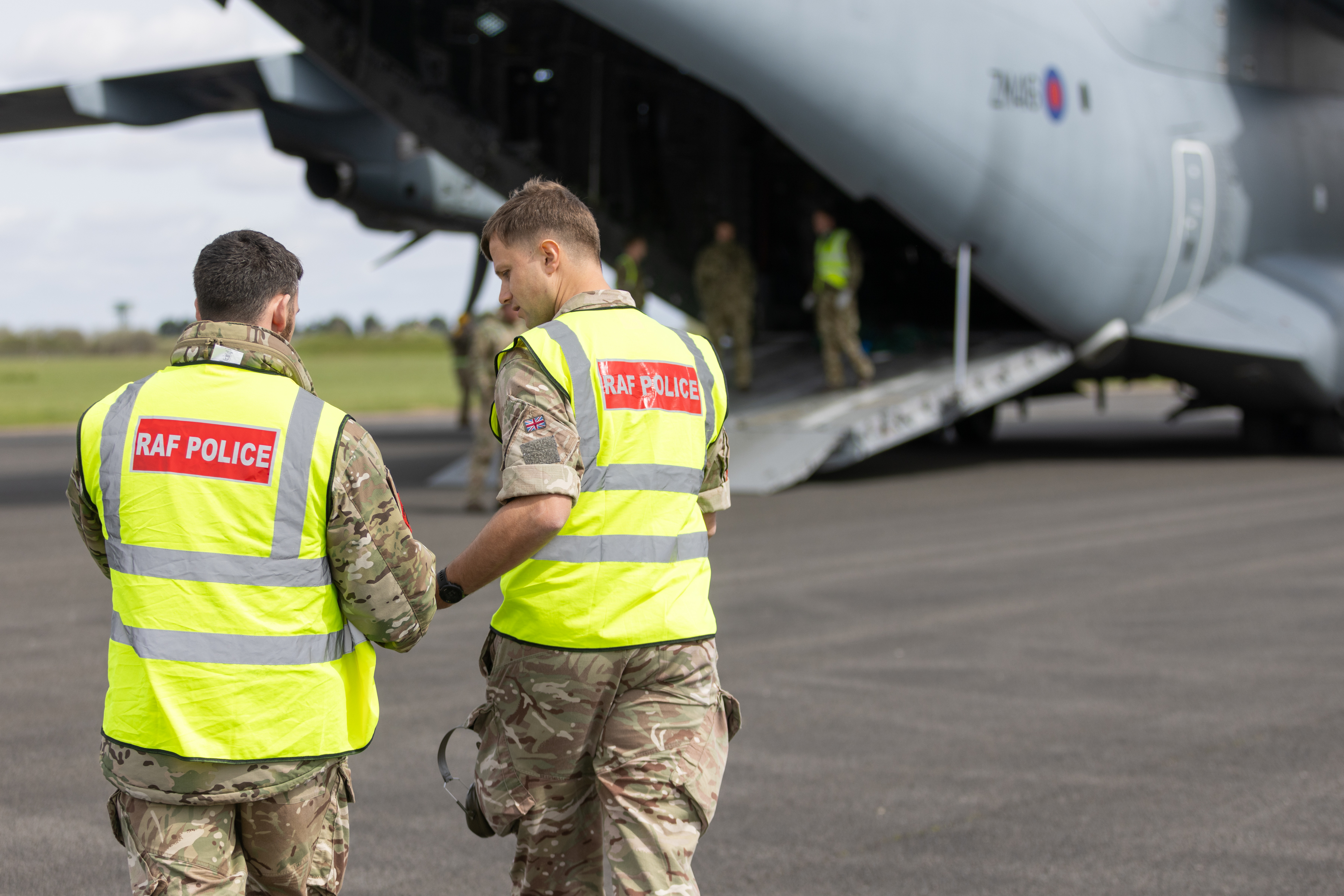 Photo: RAF Police personnel approaching an Atlas C Mk.1 aircraft.